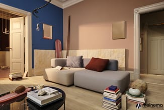 Moderne woonkamer met modulaire grijze zitbank, roze en blauwe muurkleuren, houten vloer, zwarte salontafel met boeken en dec