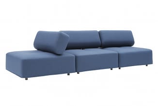 Blauwe modulaire bank met drie zitplekken, ronde armleuningen en cilindervormige rugkussens, op metalen poten.