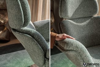 Grijze gestoffeerde stoel met textielklinkerwerk, details van armleuning en zitting in natuurlijk licht.