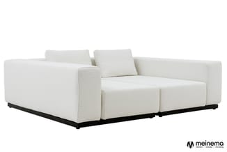 Witte modulaire bank met gewatteerde zitting, twee rugkussens, zwart metalen onderstel, twee zitplaatsen.