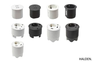 Negen ronde in-tafelstekkerdozen van Halden in wit en zwart, met USB-poorten en stopcontacten, in verschillende uitvoeringen.