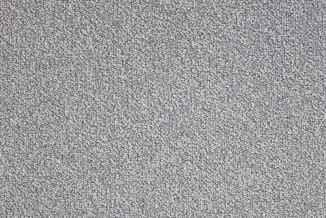 Grijze stof textuur close-up, gestructureerd weefselpatroon voor meubelbekleding of akoestische toepassing.