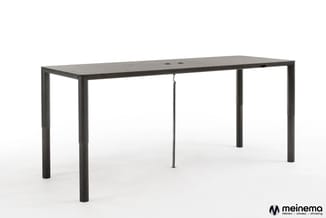 Hat in hoogte verstelbare tafel in zwart gebeitst eiken, een minimalistisch Dutch Design bureau met verborgen techniek in de poten